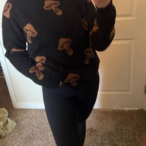 No Boundaries Black Sweater with Brown Mushroom Pattern